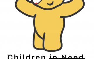 Pudsey bear, the Children in Need mascot. A yellow bear wearing a spotted eye patch accompanied by the words Children in Need. The words 'in need' are crossed out and the words 'we're failing' written in their place.