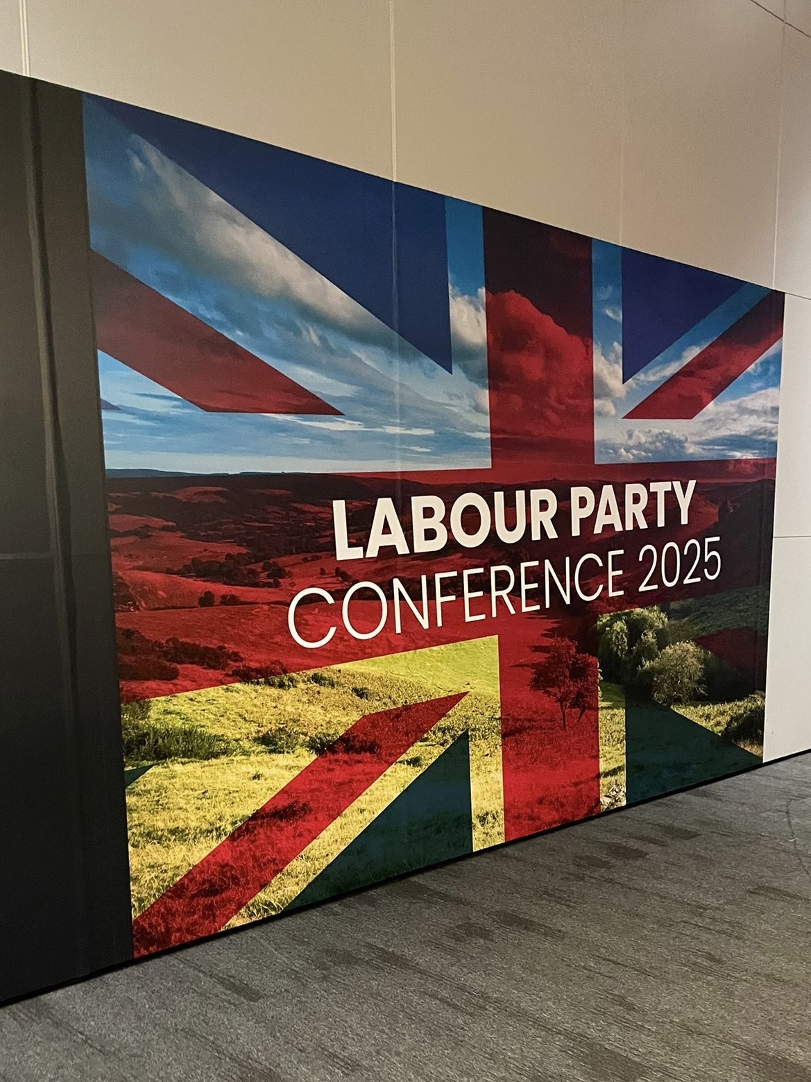 Banner with UK flag saying Labour Party Conference 2025